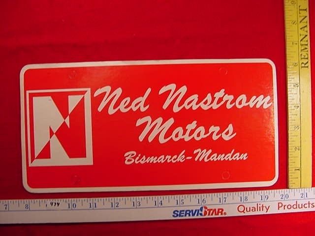 Ned Nastrom Motors Mandan Car Dealer Plate Tag Emblem